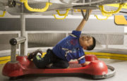Andy Li, 5, plays in a space station tool simulation at the Beyond Blastoff exhibit at Chabot Space and Science Center.