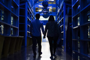 A couple walks across the Skybridge at the Chabot Space and Science Center.