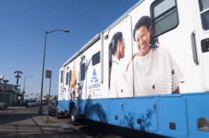 The Alameda Health System's mobile health van sits near the entrance of the East Oakland Community Project.
