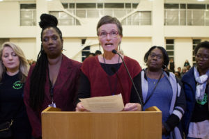 Sarah Nielsen Boyd, center, speaks before the OUSD school board along with a group of school nurses to voice concerns over their working conditions. Nielson said "the current situation is unsustainable, unsafe and unhealthy," for nurses and students. Photo by Anne Wernikoff