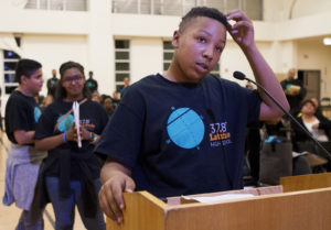 Epic middle school 8th grader Joshua Roberts speaks to the board during the public hearing on Latitude 37.8 proposed charter. Roberts hopes to attend the new charter school next-year because he likes the project-based teaching style and internship opportunities the school plans to offer. Photo by Anne Wernikoff