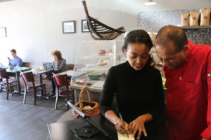 Tamirue has over 10 years experience running Enssaro Restaurant. When a deliveryman from the mobile takeout service Grubhub arrives with an order, Roberto is taken by surprise. He quickly fills the order and Tamirue phones Grubhub to figure out the most efficient way for Roberto to receive orders.