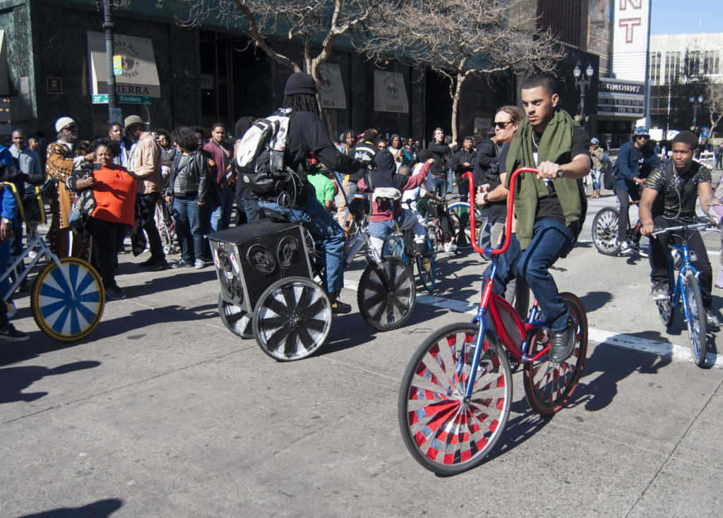 A scraper bike rider rides in the Black Joy Parade. (Photo: Drew Costley)
