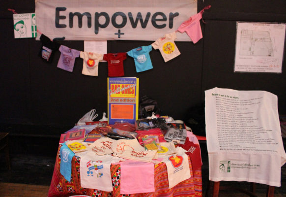 Empower Foundation set a table that displayed T-shirts and books that represent their their idea at the public meeting.