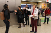Barbara Kridl(right) is distributing payday candy bars at the Rockridge BART station with other members of the AAUW's Oakland-Piedmont Branch.
