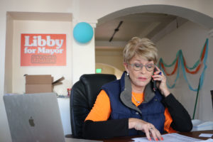 Volunteer Becky Taylor holds the desk down at Libby Schaaf’s campaign headquarters in Grand Lake. Photo by Katey Rusch.