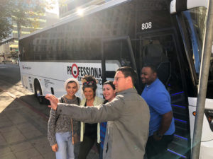 A California Democratic Party staffer whose working on Jessica Morse's campaign takes a selfie with Zahra Khan, Teri Gerritz, Leah Ahmadi and bus driver Londell Ireland before heading to Roseville, Calif. to campaign for Morse.