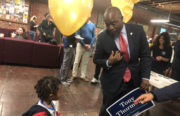 Tony Thurmond, candidate for State Superintendent for Public Instruction, arrives at his election watch party at Impact Hub, greeted by some children who had been standing by the door. Photo by Mickey Capper.