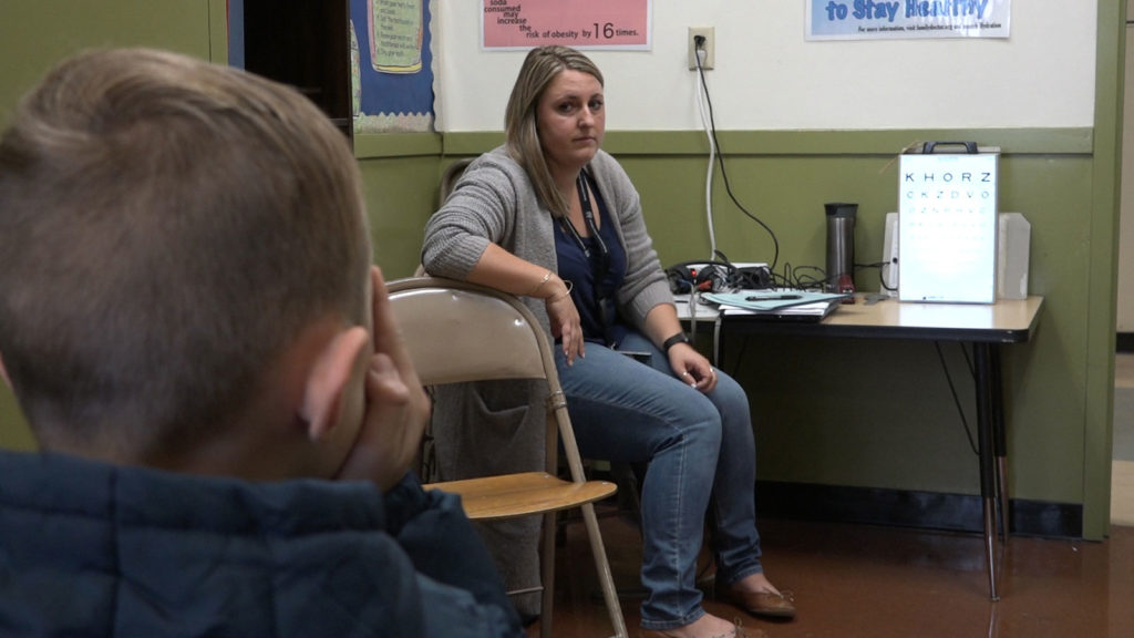 Oakland school nurse Danielle Schaefer administers a vision test—one of her many daily tasks. The nurses say their workload is overwhelming and unsustainable.