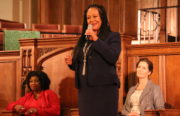 Oakland mayoral candidate Cat Brooks (center) tells the crowd gathered for a forum at First Presbyterian Church "I’m someone who loves this community deeply." Incumbent Mayor Libby Schaaf (right) and candidate Pamela Price (left) sit in silence.