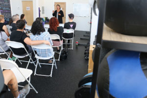 Brooks addresses a group after a workout at Radically Fit, a body positive gym for all people, telling them as mayor she'll use her "bully pulpit" every time "anyone in our community is attacked or trampled on. That's the brand of city I want to see."