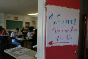 A hand-drawn sign welcomes new and old volunteers into Brooks’ campaign headquarters on Election Day.