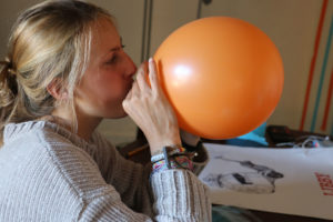 Quincy Foster, a UC Berkeley student and Schaaf campaign intern, spends her Election Day afternoon blowing up orange and blue balloons—the colors of the campaign—for that night’s watch party.