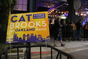 A lawn sign welcomes Brooks supporters into a Fruitvale coffee roastery to mingle and watch the returns come in.
