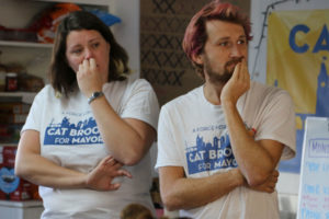 Kyle Schulze (right) and another Brooks’ campaign volunteer look on as campaign field coordinator, Katie Tertocha (not pictured) explains the plan to get out the vote on the weekend before the election.
