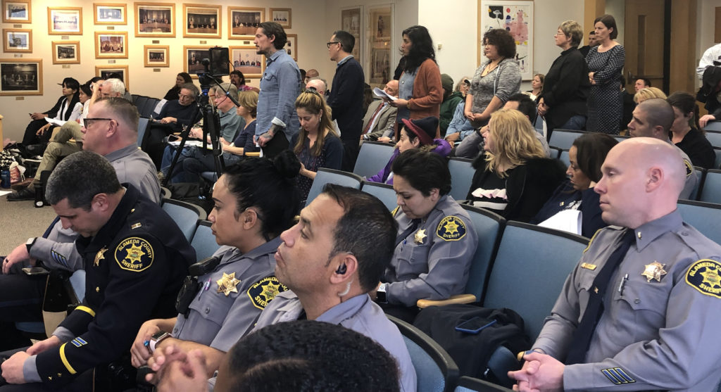 At the Alameda County Board of Supervisors Meeting on February 27, members of the public wait to speak.