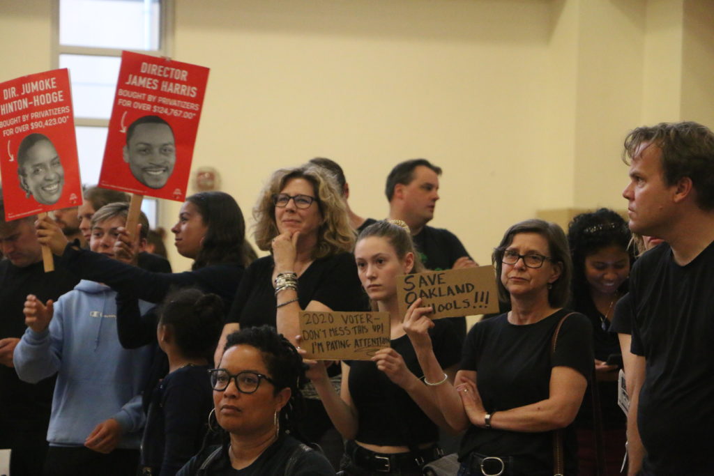 Audrey McGuinness, former Kaiser Elementary student, and Anne McGuinness, current Kaiser Elementary teacher, protest the school board's proposed merger of Kaiser and Sankofa. Photo by Michelle Pitcher.