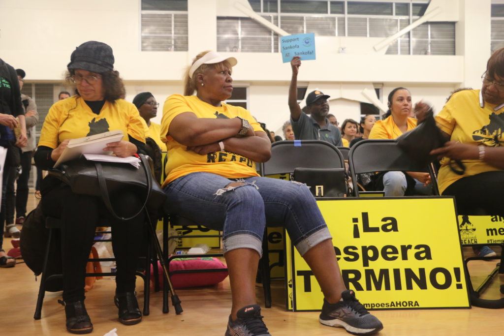 Members of The Oakland Reach, a parent-led advocacy group, showed up by the dozens to speak out for students of color. Photo by Michelle Pitcher.