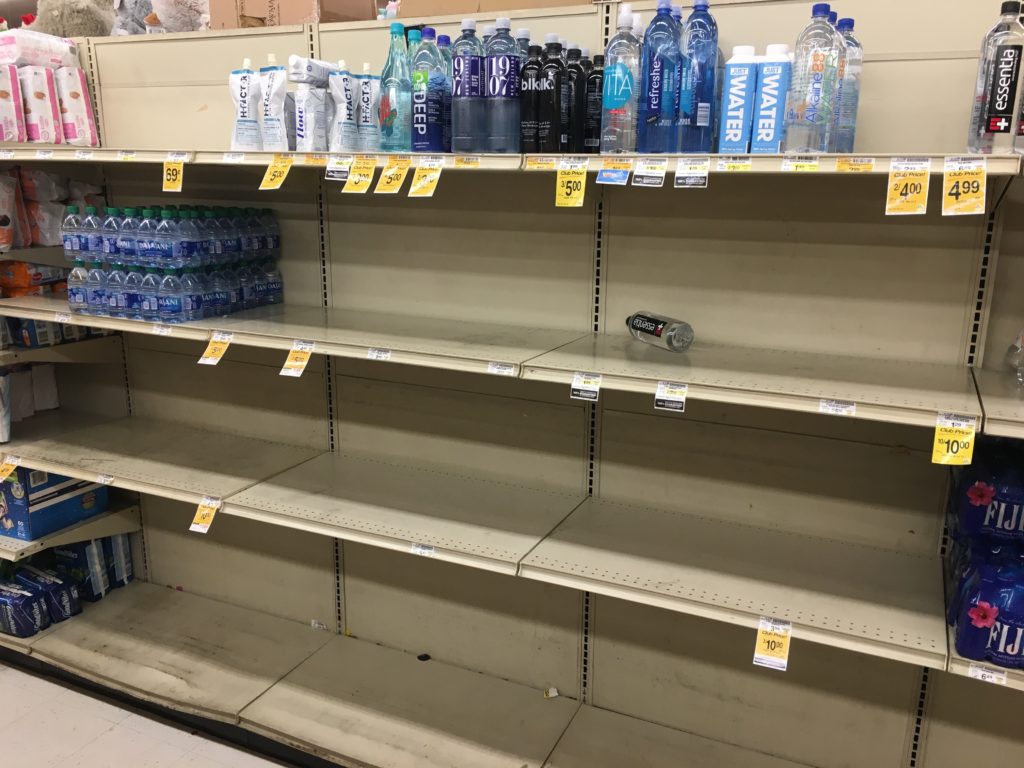 Bottled water is in short supply as shoppers stock up at the Safeway on Fruitvale Avenue, preparing for a planned PG&E power outage. Photo by Caroline Hart.