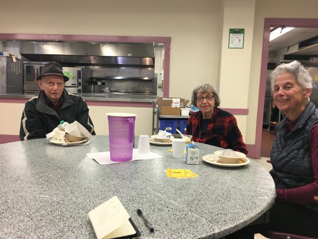 The table of regulars. From left, Clair Styve, Marge Black and Jean Mundy. They sit with finished plates of food in front of them.