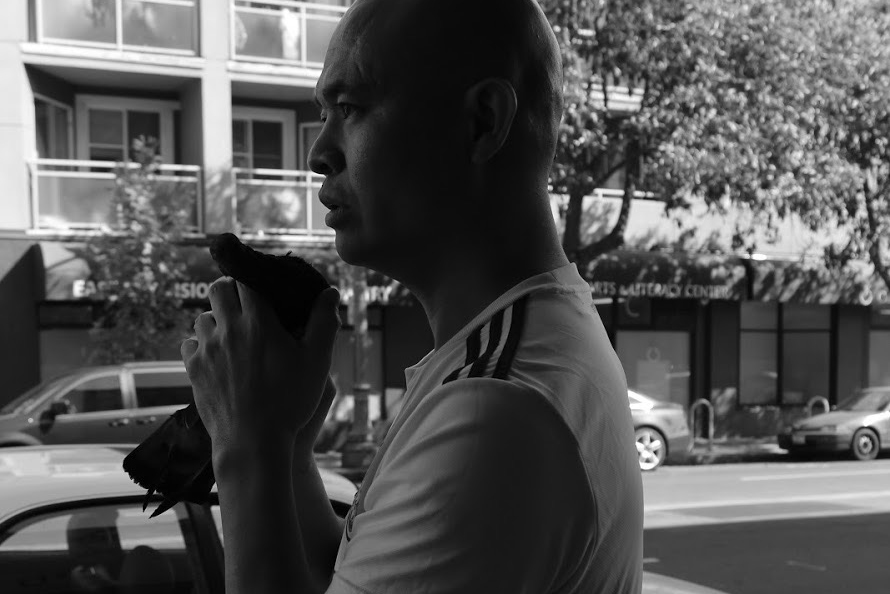 After helping the injured pigeon, Nan says a prayer to it before releasing it back outside. Photo by Jocelyn Tabancay