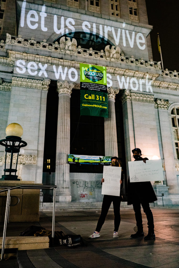 Sex workers protest the earn it act in front of city hall in Oakland. Photo by Cammy Leone. 